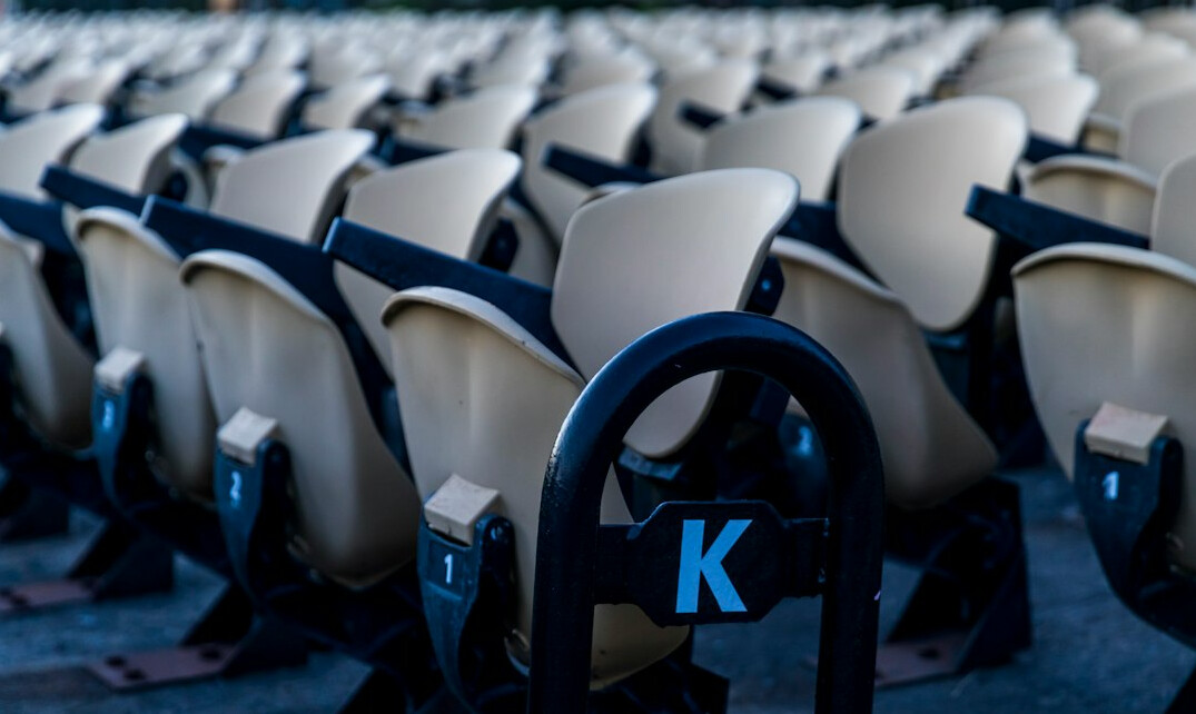 Empty theatre auditorium with rows of seats